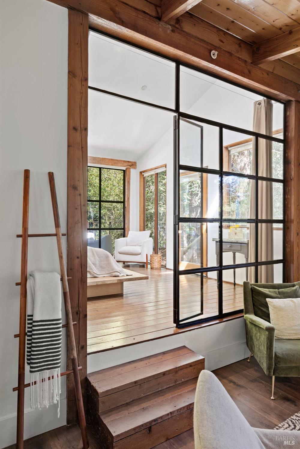 16798 Armstrong Woods Road Guerneville, CA 95446 - Photo 22 of 71 a living room with a large window