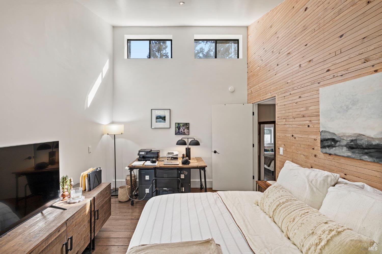 16798 Armstrong Woods Road Guerneville, CA 95446 - Photo 31 of 71 a bedroom with a bed and a flat screen tv