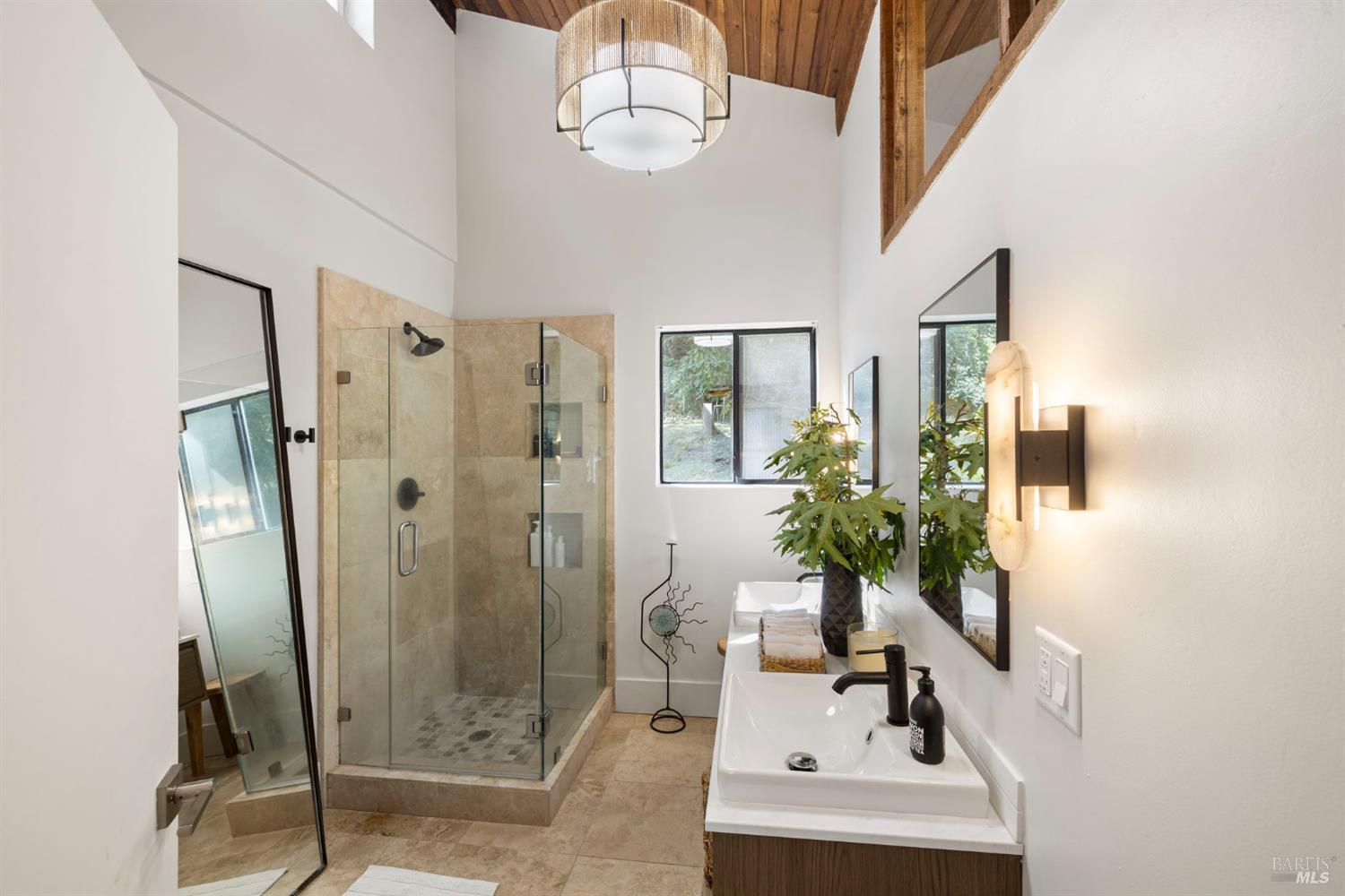 16798 Armstrong Woods Road Guerneville, CA 95446 - Photo 38 of 71 a bathroom with a sink a mirror and a shower