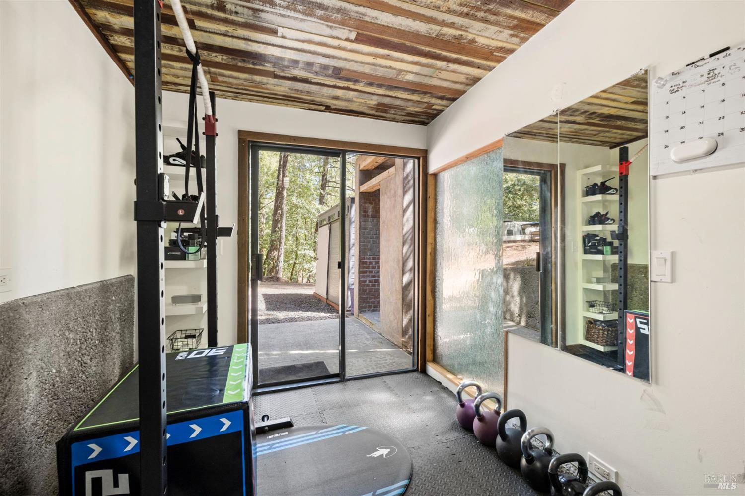 16798 Armstrong Woods Road Guerneville, CA 95446 - Photo 51 of 71 a view of an entryway with a floor to ceiling window