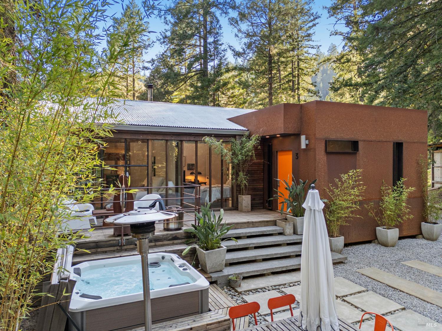 16798 Armstrong Woods Road Guerneville, CA 95446 - Photo 66 of 71 a view of a chairs and table in backyard of the house