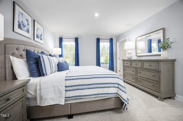 a bedroom with a bed and lamp