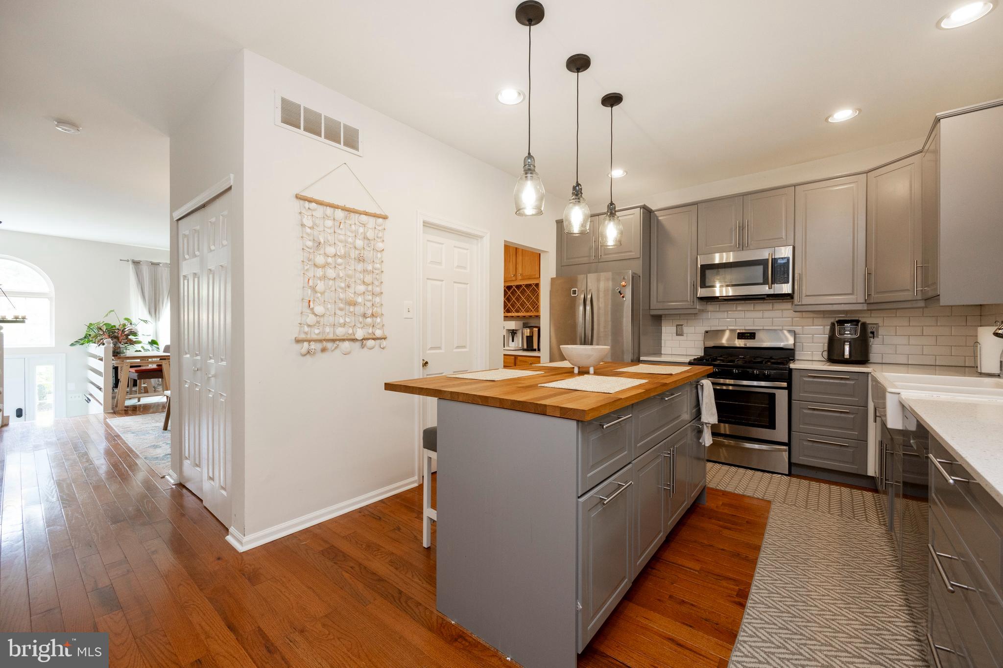108 Brandywine Road Malvern, PA 19355 - Photo 14 of 35 a large kitchen with stainless steel appliances granite countertop a stove and a wooden floors