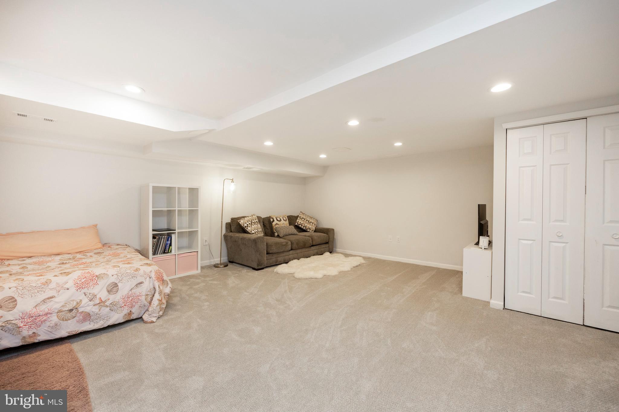 108 Brandywine Road Malvern, PA 19355 - Photo 31 of 35 a large bedroom with a bed and a large window