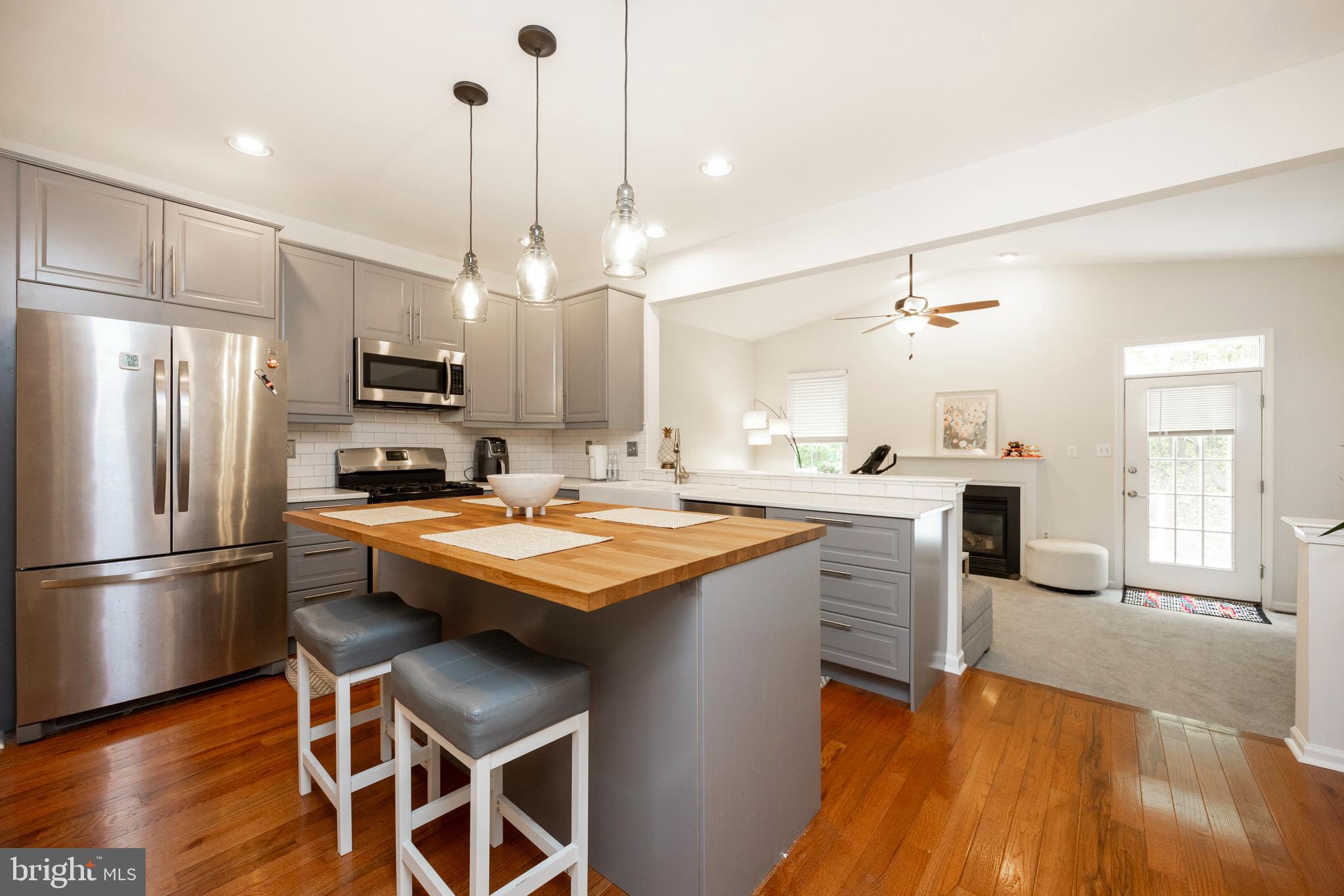 108 Brandywine Road Malvern, PA 19355 - Photo 9 of 35 a kitchen with kitchen island white cabinets and stainless steel appliances