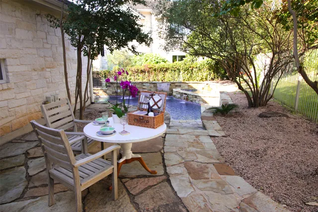 a living room with furniture and view of kitchen