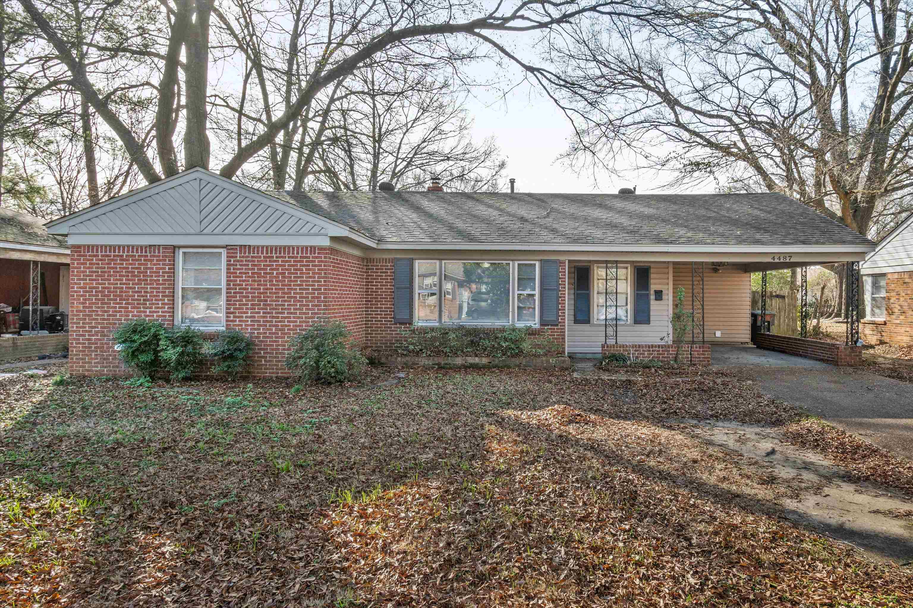 4487 East Dearing Road Memphis, TN 38117 - Photo 1 of 27 Single story home with a carport, covered porch, driveway, a shingled roof, and brick siding