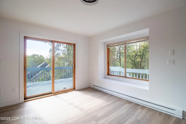 a view of hallway with wooden floor