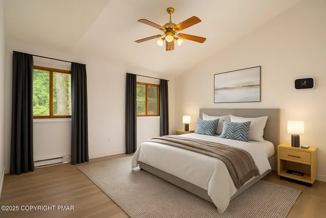 a bathroom with a toilet a sink a vanity and mirror