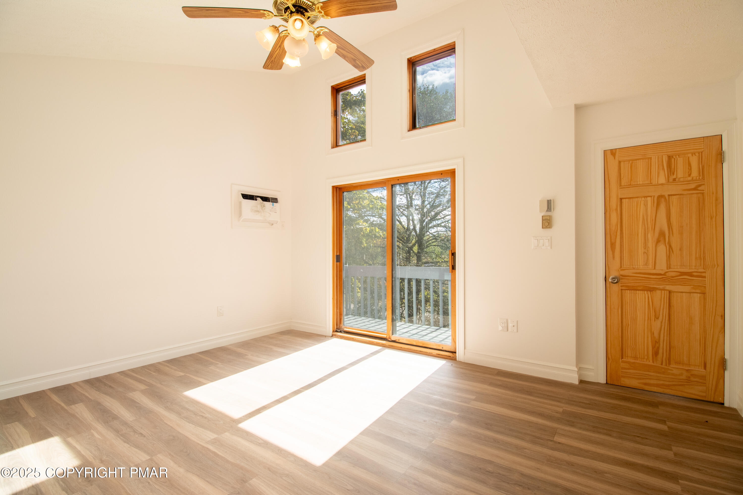 1142 Yorkshire Lane Bushkill, PA 18324 - Photo 27 of 72 a view of a livingroom with wooden floor and a ceiling fan