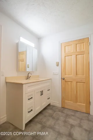a view of balcony with wooden floor and fence