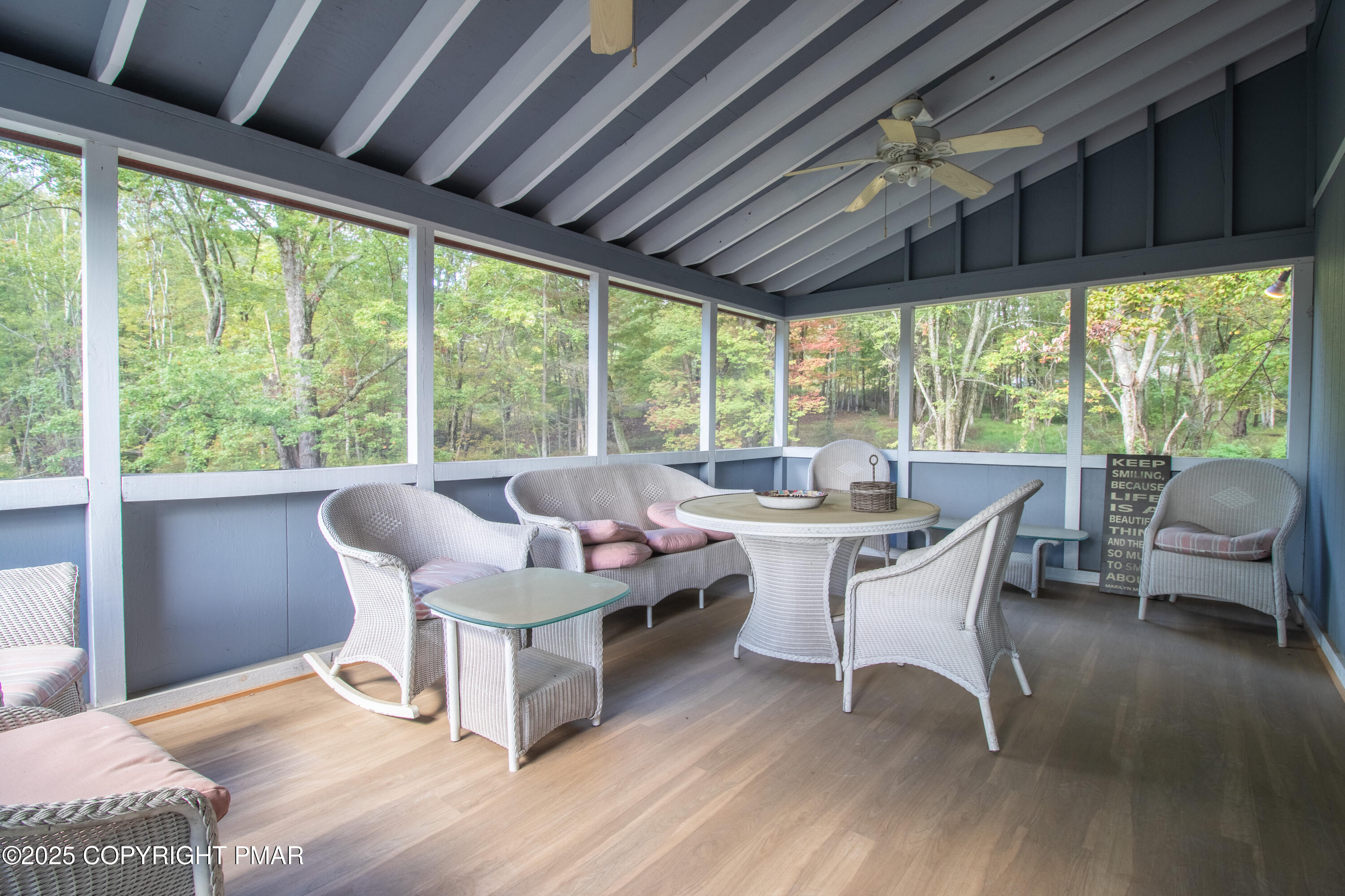 1142 Yorkshire Lane Bushkill, PA 18324 - Photo 39 of 72 a dining room with furniture window and wooden floor