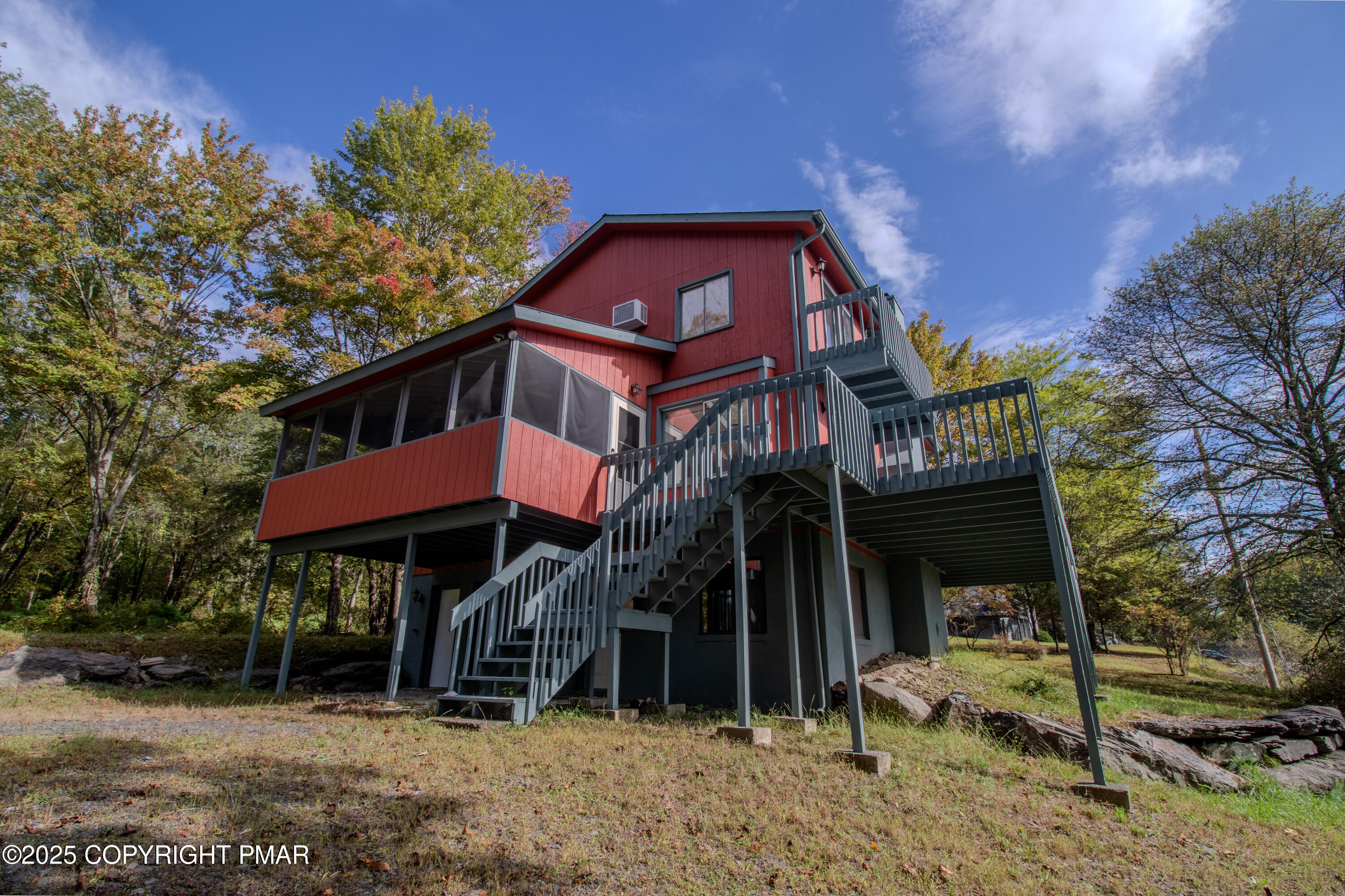 1142 Yorkshire Lane Bushkill, PA 18324 - Photo 44 of 72 a view of a house with a yard and sitting area