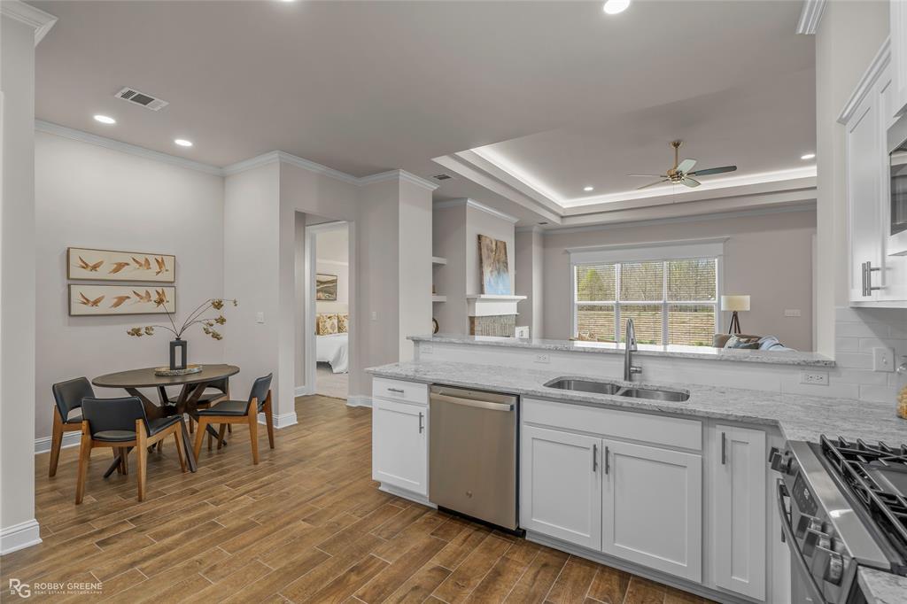316 Peason Ridge Bossier City, LA 71112 - Photo 11 of 36 a kitchen with stainless steel appliances granite countertop a sink and cabinets