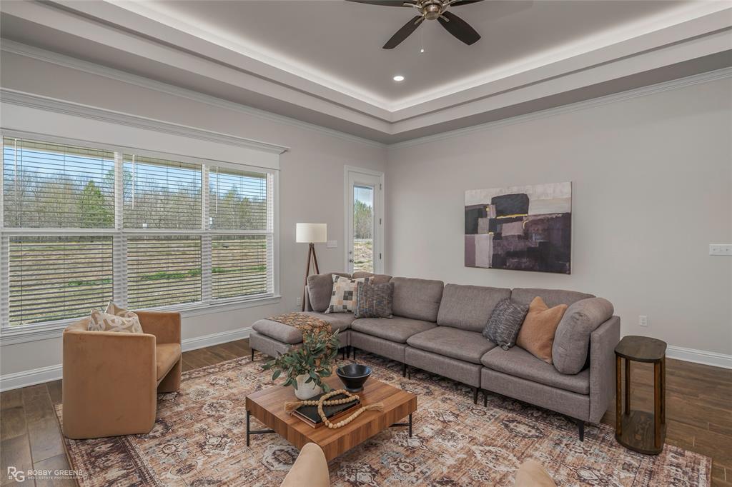 316 Peason Ridge Bossier City, LA 71112 - Photo 19 of 36 a living room with furniture and floor to ceiling windows