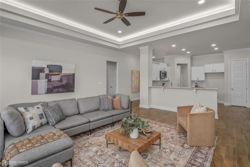 316 Peason Ridge Bossier City, LA 71112 - Photo 20 of 36 a living room with furniture kitchen view and a chandelier