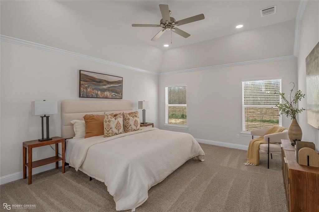 316 Peason Ridge Bossier City, LA 71112 - Photo 21 of 36 a bedroom with a bed a couch and large window