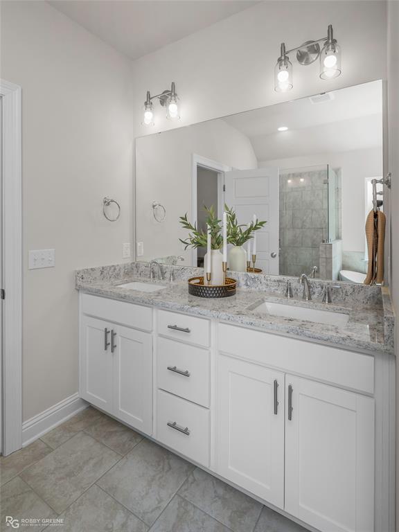 316 Peason Ridge Bossier City, LA 71112 - Photo 23 of 36 a bathroom with a granite countertop double vanity sink and a mirror