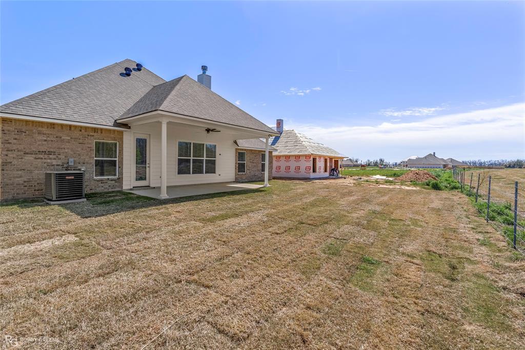 316 Peason Ridge Bossier City, LA 71112 - Photo 33 of 36 a view of a house with a yard