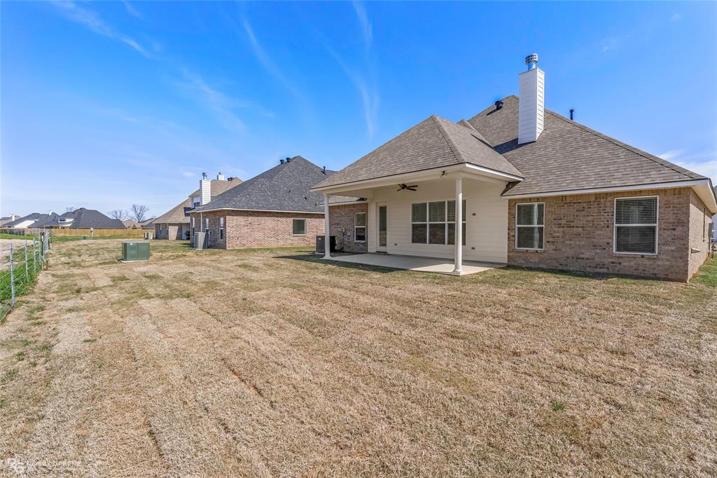 316 Peason Ridge Bossier City, LA 71112 - Photo 34 of 36 a front view of a house with a yard