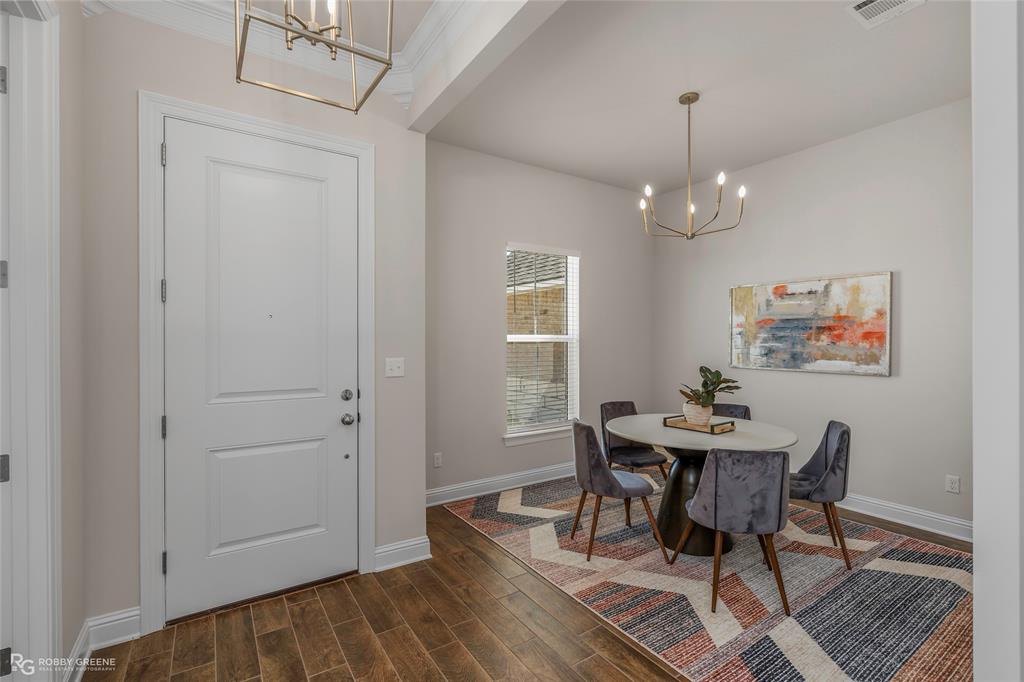316 Peason Ridge Bossier City, LA 71112 - Photo 8 of 36 a view of a dining room with furniture and wooden floor