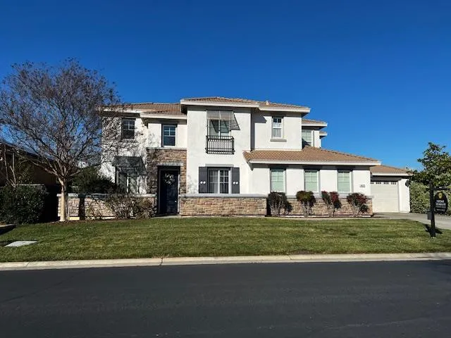 a view of a building with a yard