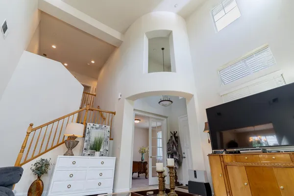 a view of a livingroom with furniture and flat screen tv