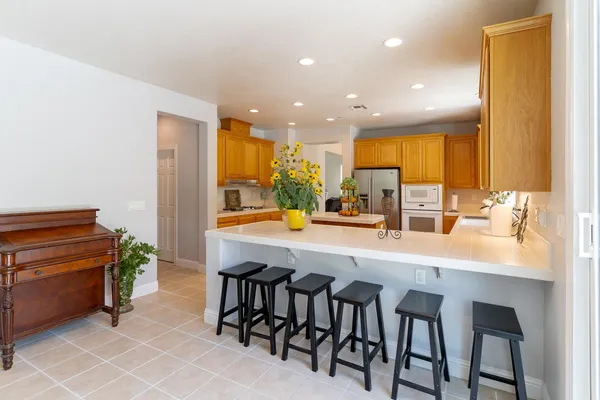 a kitchen with a table and chairs in it