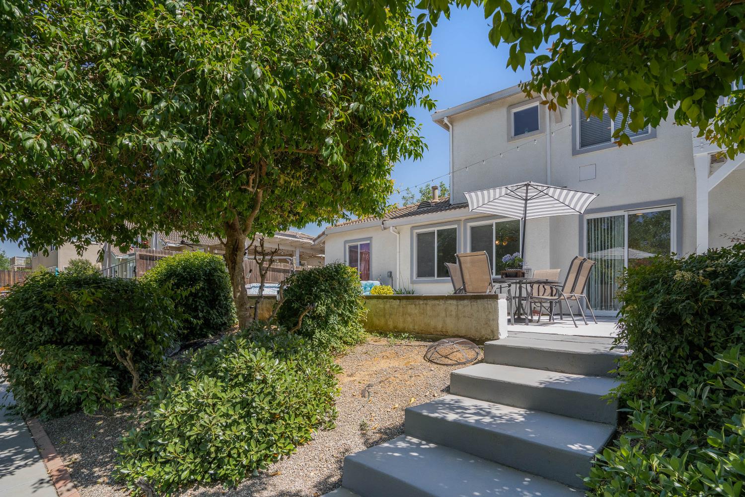 34676 Canvas Back Street Woodland, CA 95695 - Photo 21 of 28 a front view of a house with yard and green space