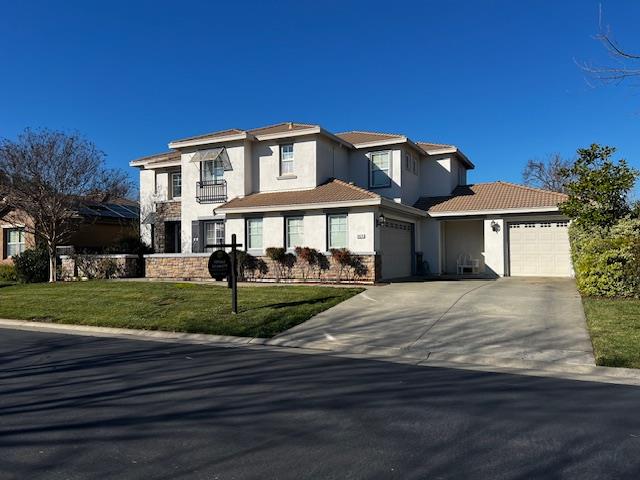34676 Canvas Back Street Woodland, CA 95695 - Photo 27 of 28 a view of house with a garden and pathway