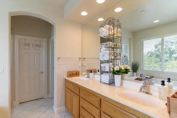 a bathroom with a sink and a large mirror