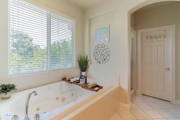 a bathroom with a bathtub and a shower