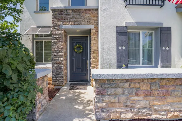 a front view of a house with a blue gate