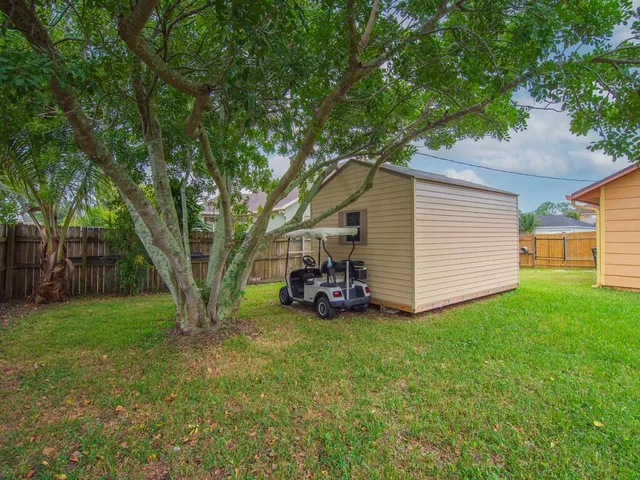 a backyard of a house with lots of green space