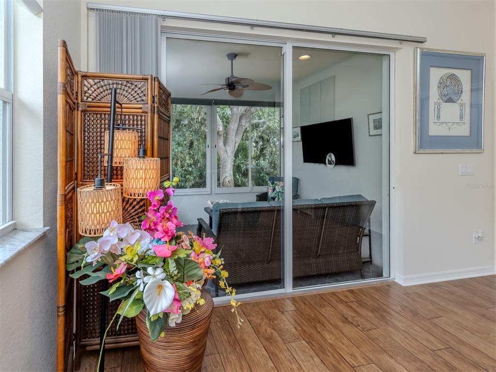 205 Reclinata Circle Venice, FL 34292 - Photo 14 of 62 a living room with furniture and a flat screen tv