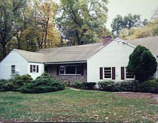 128 Pond Road Stamford, CT 06902 - Photo 1 of 1 a house that has a tree in front of it