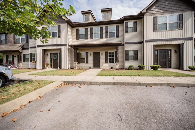 a view of a white building with a large windows