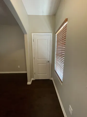 an entryway in a house with wooden floor