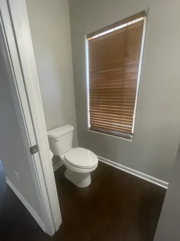 a bathroom with a sink a mirror and a toilet