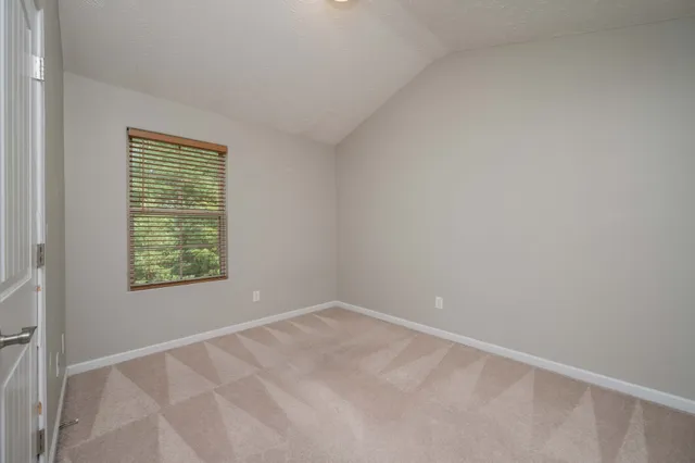 a bathroom with a sink toilet vanity and shower