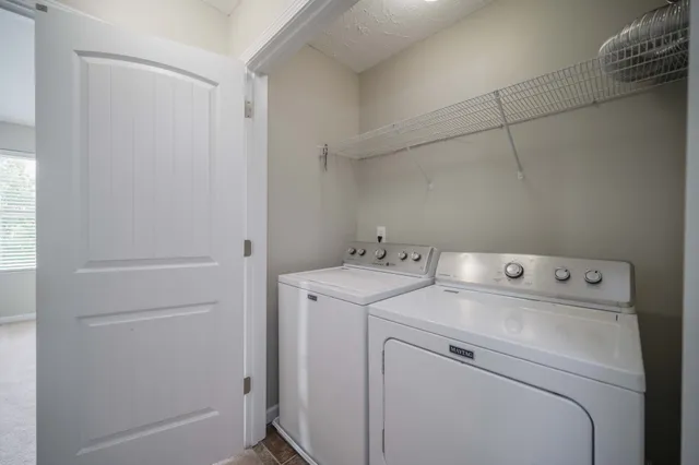 a view of a utility room with closet