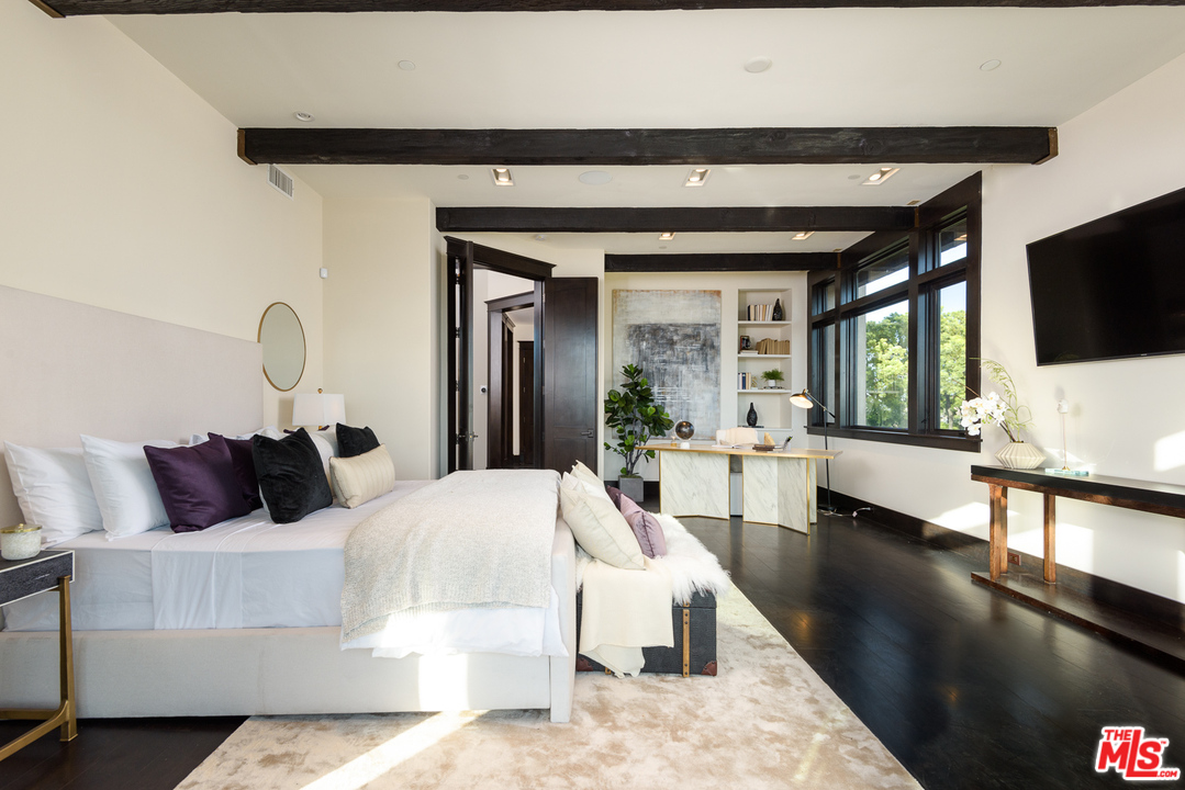 2175 Summitridge Drive Beverly Hills, CA 90210 - Photo 26 of 51 a living room with furniture and a flat screen tv