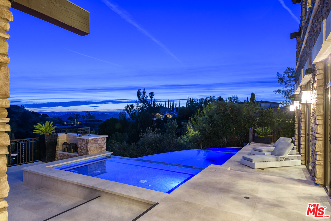2175 Summitridge Drive Beverly Hills, CA 90210 - Photo 43 of 51 a view of swimming pool with sitting area
