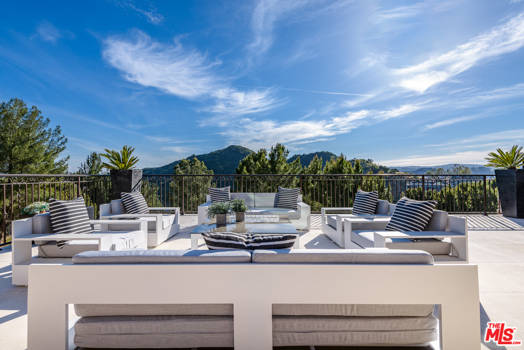 2175 Summitridge Drive Beverly Hills, CA 90210 - Photo 46 of 51 a view of swimming pool with outdoor seating and plants