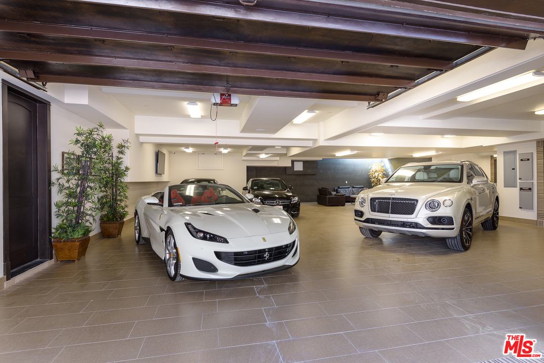 2175 Summitridge Drive Beverly Hills, CA 90210 - Photo 49 of 51 a car parked in garage