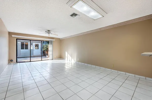 a view of an empty room and window
