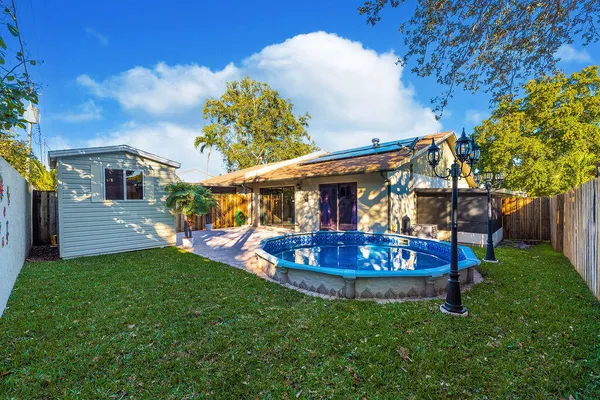 a view of a house with a yard porch and sitting area