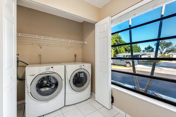 a view of a hallway with washer and dryer