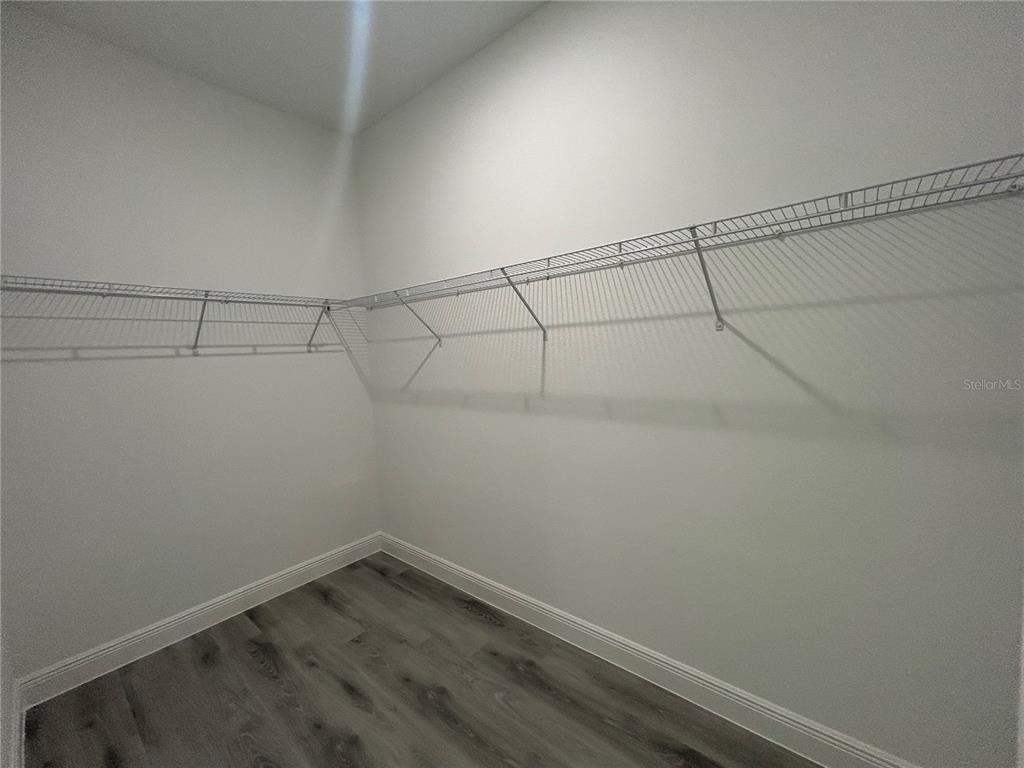 555 Marion Oaks Golf Road Ocala, FL 34473 - Photo 17 of 34 a view of a room with racks on the wall