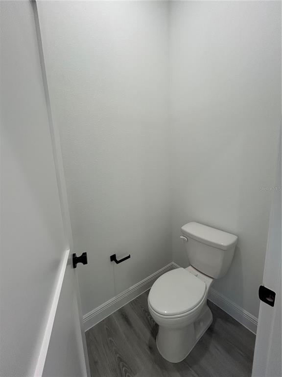 555 Marion Oaks Golf Road Ocala, FL 34473 - Photo 19 of 34 a white toilet sitting next to a white sink